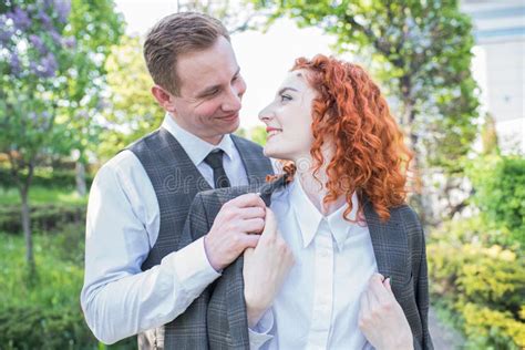 Redhead Couple Wife Hugs Her Husband And Looks At The Camera Stock