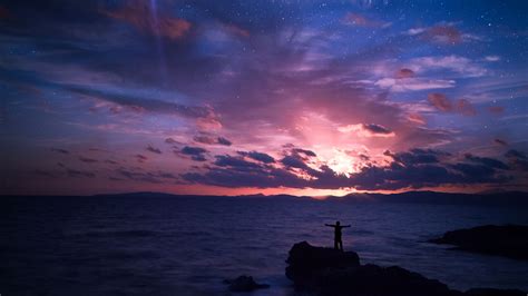 Download Wallpaper 2560x1440 Starry Sky Silhouette Rock Sea Horizon
