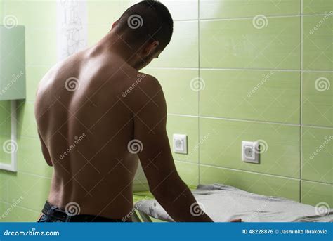 Naked Man Ironing Clothes In A Utility Room Photo Stock Image Du