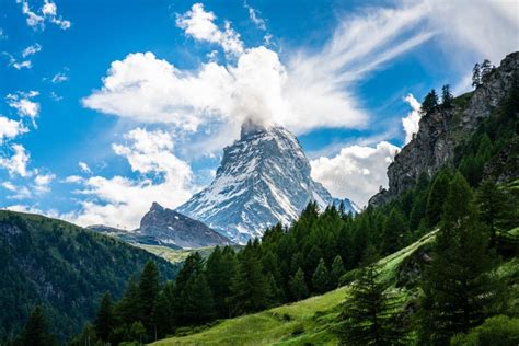 Scenic View Of The Matterhorn Mountain Summit With Snow Clouds Blue Sky