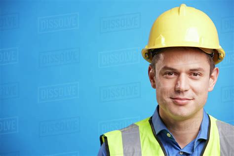 Smiling Young White Construction Worker In Hard Hat Stock Photo