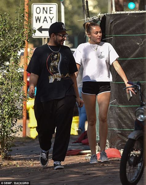 miley cyrus pulls on her shorts for a run daily mail online