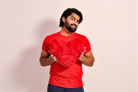 Premium Photo Valentines Day Concept Indian Man Handsome Young Holding A Red Heart Shaped