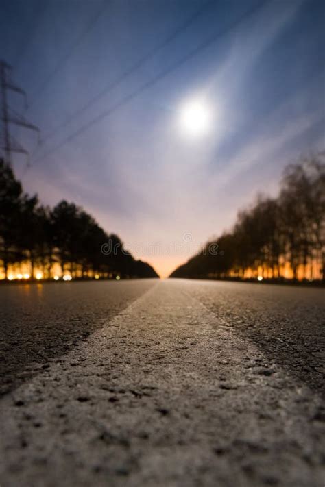 Empty Night Asphalt Road Bright Full Moon Behind Clouds And City Light