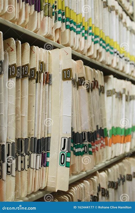 Medical Record Charts On Shelve Sorted Alphabetically Stock Image