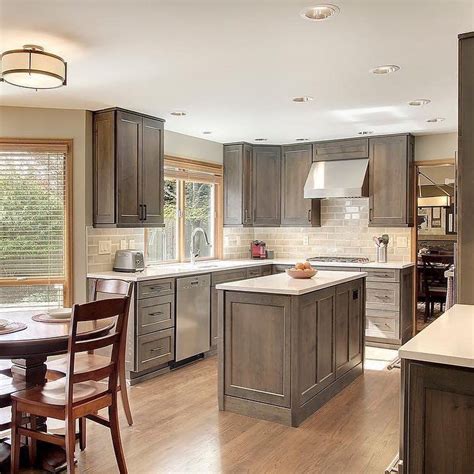 Gorgeous Warm Gray Stained Kitchen Cabinets With Stainless Appliances