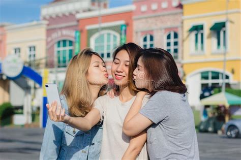 Attractive Beautiful Asian Friends Women Using A Smartphone Happy