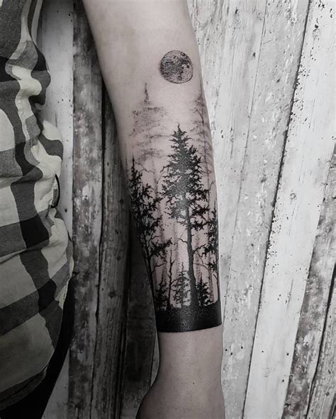 Black Tattoo Of A Forest And Moon Inked On The Left Forearm Tatuagens
