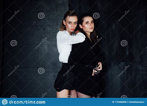 Portrait Of Two Beautiful Fashionable Stylish Female Girlfriends
