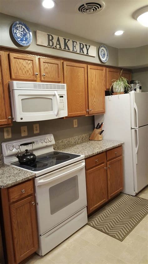 Simple, classic, dark charcoal grey cabinetry looks modern yet elegant in this simple open galley style kitchen space. Pin on farm/cottage warmth