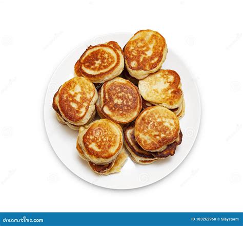 A Pile Of Freshly Baked Pancakes Lay On A Plate Isolated On White