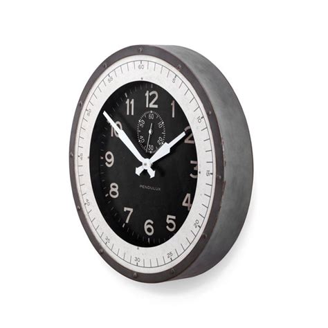A Black And White Clock With Numbers On The Face Is Shown Against A