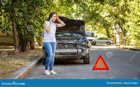 Driver Woman In Front Of Wrecked Car In Car Accident Scared Woman In