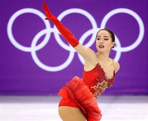 A Female Figure Skating On The Ice