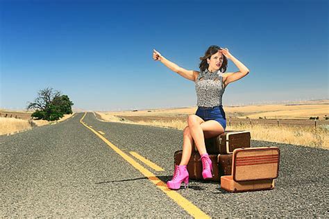 Royalty Free Suitcase Hitchhiking High Heels Sitting Pictures Images