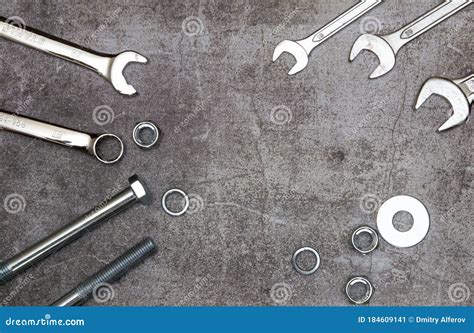 Wrenches Bolt Nut And Washers On A Gray Concrete Background Top View