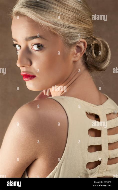 Beautiful Young Woman Looking Over Shoulder Stock Photo Alamy