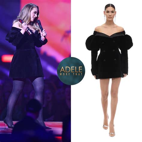 The Model Is Wearing An Off Shoulder Black Velvet Dress With Sheer