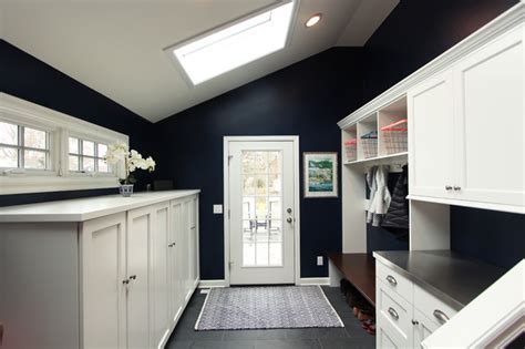 Navy Blue Mudroom With White Built In Cabinets With Coat Storage