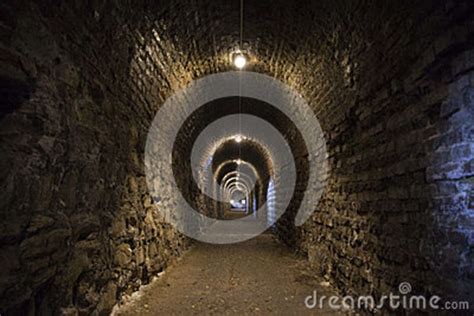 Background Of The Tunnel From Stone And Brick Walls Texture Stock Photo