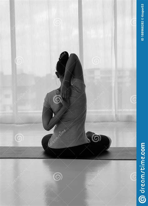 Female Doing Stretching Exercises Yoga Hands Behind Back Sitting In