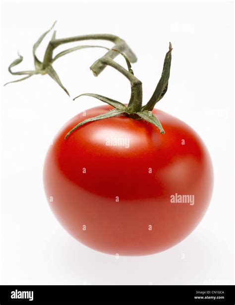 Whole Red Cherry Tomato With Stem Stock Photo Alamy