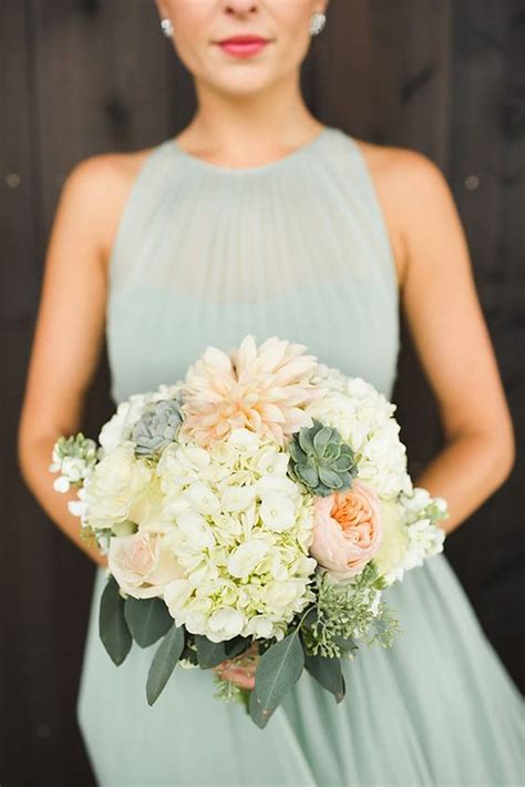 Bridesmaids Wearing Sage Green Dress And Holding A Peach Coloured