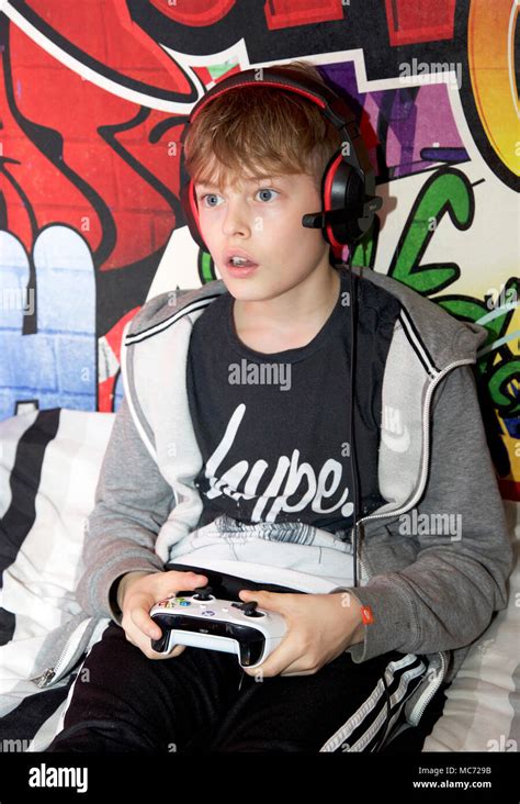 Boy Playing On Xbox One In His Bedroom Stock Photo Alamy