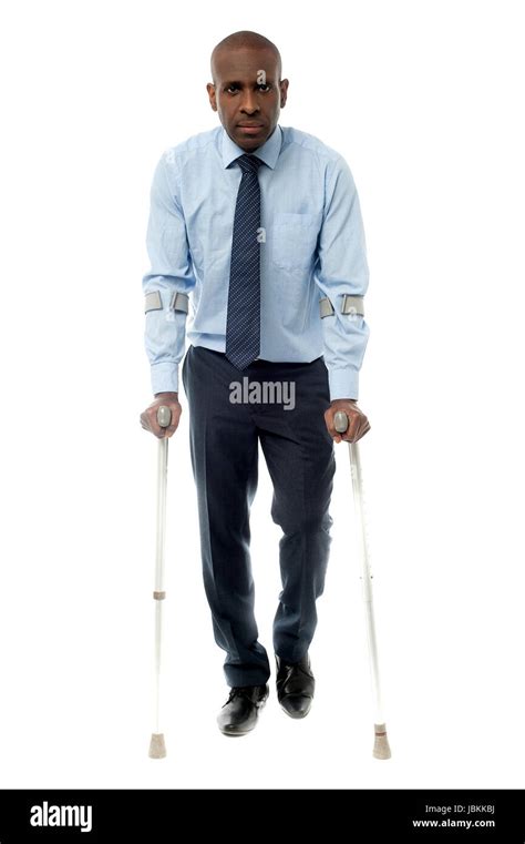 African Businessman Man Walking With Crutch Stock Photo Alamy