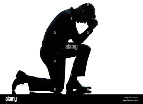 One Caucasian Man Kneeling Sadness Praying Full Length Silhouette In
