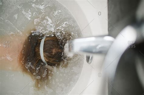 Girl With Head Underwater In Tub Stock Photo OFFSET