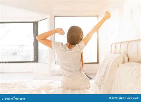 Morning Woman Waking Up In Bed In Sunrise Sunlight Glow From Window Early Bird Happy Girl In