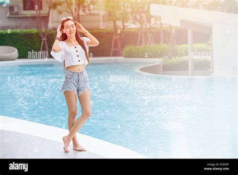 Skinny Asian Girl Teen Relax Smile Standing At Swimming Pool Holiday