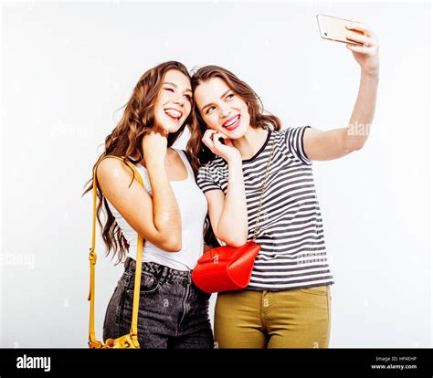 Two Best Friends Teenage Girls Together Having Fun Posing Emotional On White Background