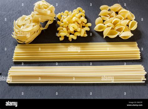 Different kinds of uncooked dried pasta, spaghetti,linguine,spirali ...