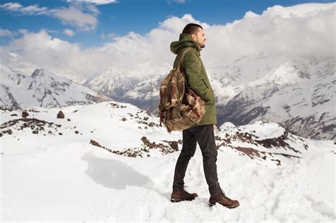 Free Photo Young Hipster Man Hiking In Mountains Winter Vacation