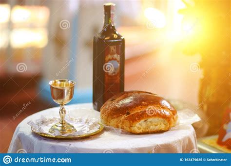 Holy Communion On Wooden Table In Churchtaking Communioncup Of Glass