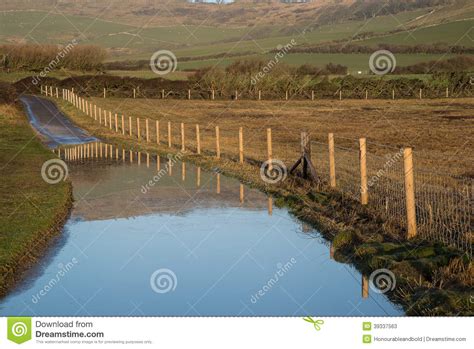 Landscape Image Of Flooded Country Lane In Farm Stock Image Image Of