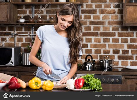 You may want to invite a big group, but perhaps you only have. Woman cooking dinner — Stock Photo © EdZbarzhyvetsky ...