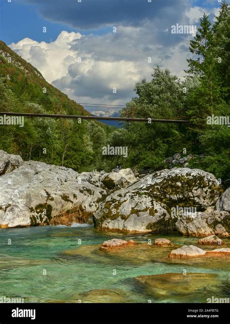 Vertical Photo Of Beautiful And Clean River In Slovenia Called Soca In