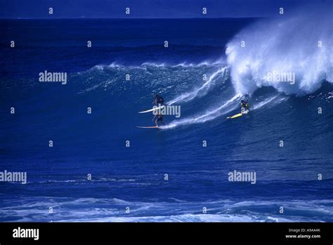 Surfers On Big Shorebreak Wave Waimea Bay North Shore Oahu Hawaii Usa