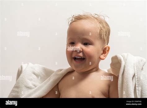 Boy With Blonde Hair In A Towel Laugh After Bathing Stock Photo Alamy