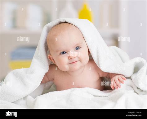Smiling Baby Girl Lying Under Towel Stock Photo Alamy