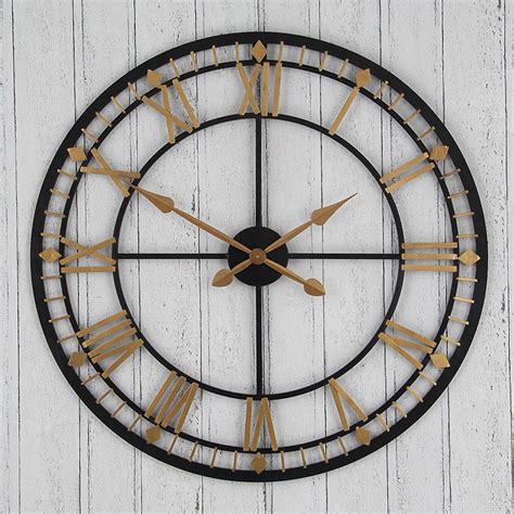 antique black and gold metal wall clock
