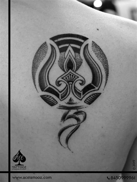 Finding a tattoo design that you want inked on your skin forever is a process. Trishul with OM God Tattoo Designs - Ace Tattooz