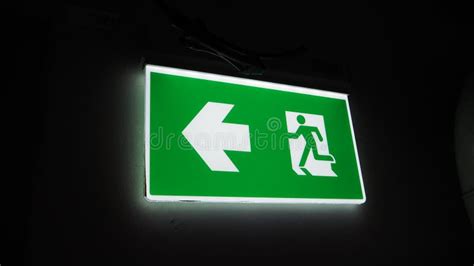 Emergency Fire Exit Sign Direction To Doorway In The Building Green