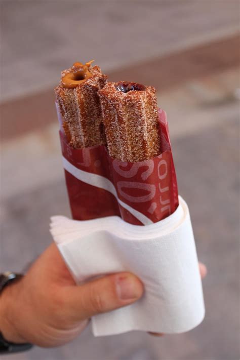 Chocolate And Caramel Filled Churros Coming From Churro Truck In