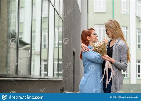Same Sex Relationships Happy Lesbian Couple With Dried Flowers Stock