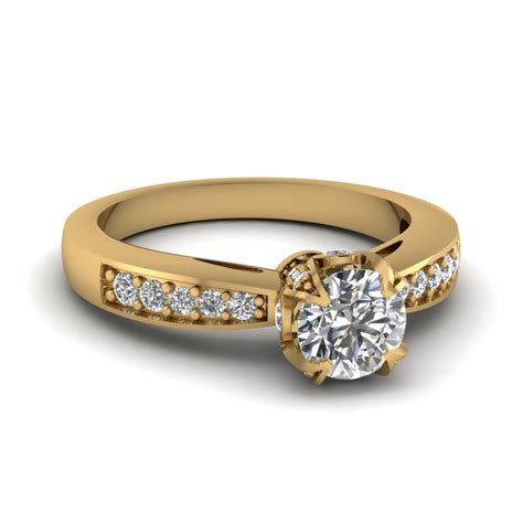 Asymmetrical hand carved band cast in 18k yellow gold with a basket setting that holds a.96 ct oval brilliant cut white diamond. 15 Latest Designs of Gold Diamond Rings for Him & Her
