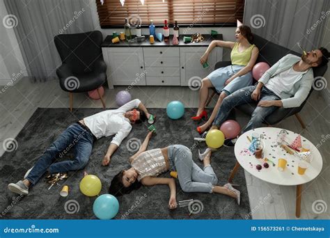 Group Of Friends Sleeping In Messy Room After Party Stock Image Image Of Alcohol Bottle